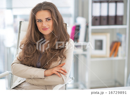 Portrait of happy business woman in office Portrait of happy business woman in office 16729891