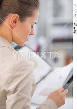 Business woman working with documents 16729903
