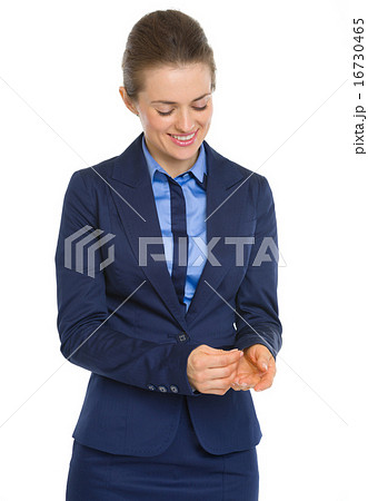 Happy business woman adjusting cuff Happy business woman adjusting cuff 16730465