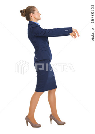 Full length portrait of business woman walking like zombie Full length portrait of business woman walking like zombie 16730553