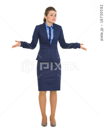 Portrait of clueless business woman shrugging shoulders 16730592