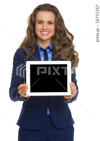 Smiling business woman showing tablet pc blank screen 16731267