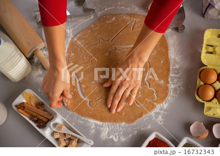 Closeup on young housewife making christmas cookies Closeup on young housewife making christmas cookies 16732343