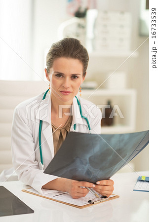 Medical doctor woman with fluorography in office Medical doctor woman with fluorography in office 16733539