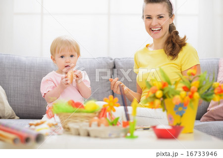 Baby and mother having fun on Easter 16733946