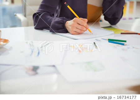 Closeup on fashion designer working in office Closeup on fashion designer working in office 16734177