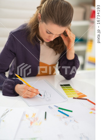 Fashion designer working in office Fashion designer working in office 16734193