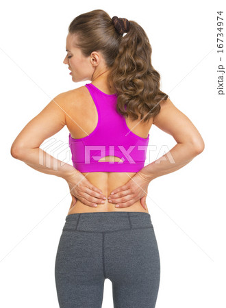 Female athlete having backache Female athlete having backache 16734974