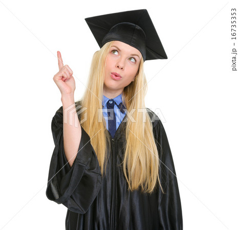 Happy young woman in graduation gown got idea Happy young woman in graduation gown got idea 16735353