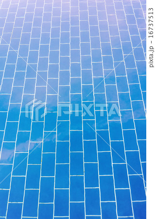 Blue tiled floor of a pool under clear water Blue tiled floor of a pool under clear water 16737513