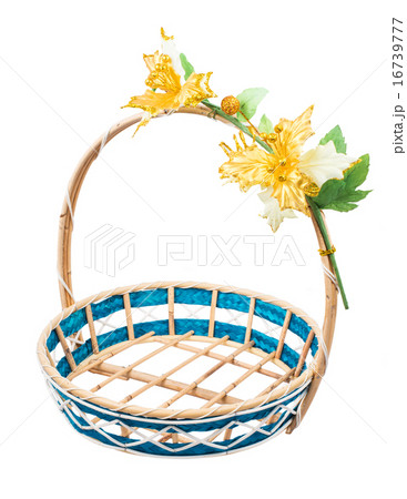 Empty wicker basket with flower, white background Empty wicker basket with flower, white background 16739777