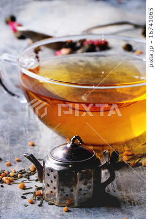 Cup of hot tea with tea strainer 16741065