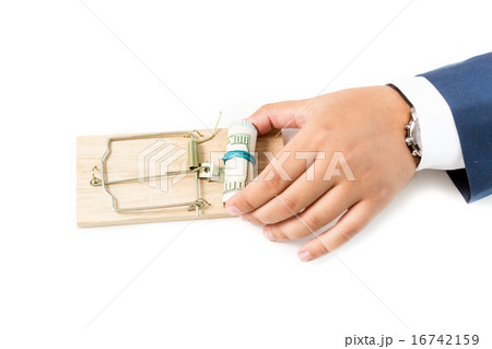 photo of businessman putting money in mousetrap 16742159