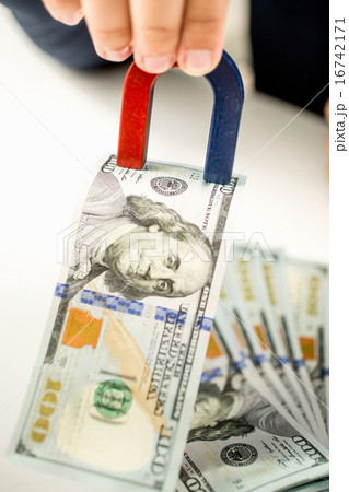 shot of official stealing money with use of magnet shot of official stealing money with use of magnet 16742171