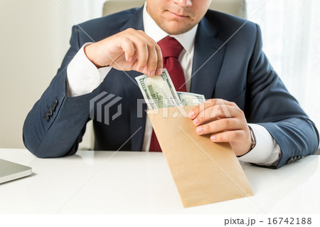 bribed politician taking envelope with money bribed politician taking envelope with money 16742188