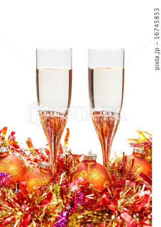 two glasses of champagne and gold Christmas bauble 16745853