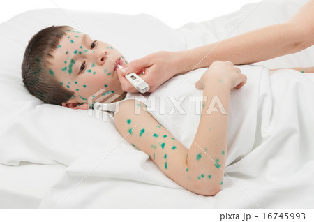 temperature measurement sick boy in bed 16745993