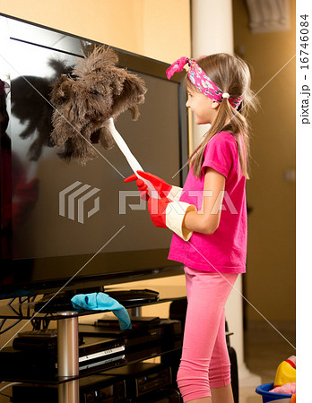 girl in gloves cleaning big TV from dust with brus girl in gloves cleaning big TV from dust with brus 16746084