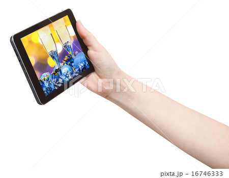 hand holds tablet pc with Xmas still life 16746333