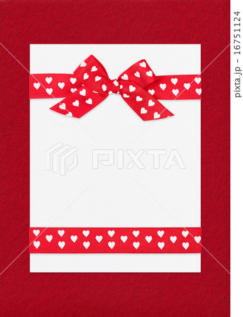 red bow on paper sheet red bow on paper sheet 16751124