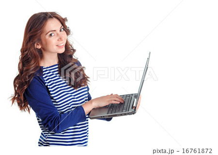 Smiling girl holding laptop  16761872