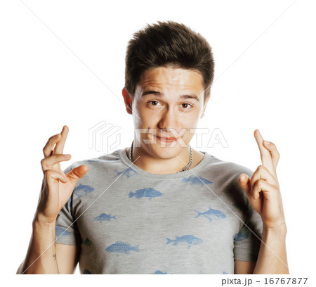 young pretty handsome man isolated hoping crossed fingers young pretty handsome man isolated hoping crossed fingers 16767877