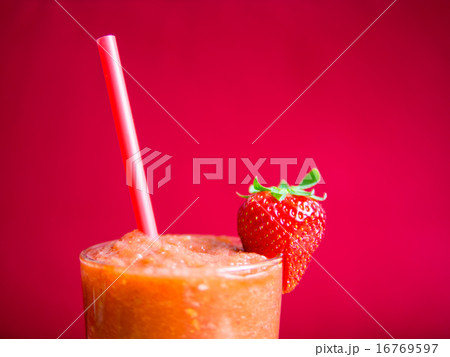 Strawberry smoothie in glass with straw - detail Strawberry smoothie in glass with straw - detail 16769597
