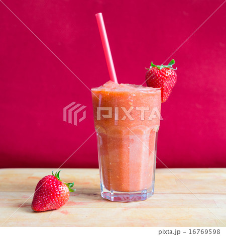 Strawberry smoothie in glass with straw 16769598