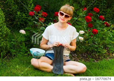 young wooman with needlework 16770674