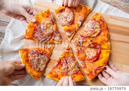 close up of hands and homemade pizza close up of hands and homemade pizza 16770979