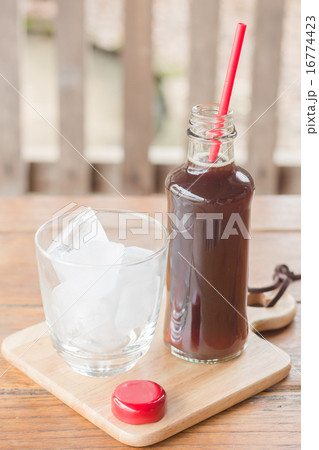 Bottle of black coffee with ice 16774423