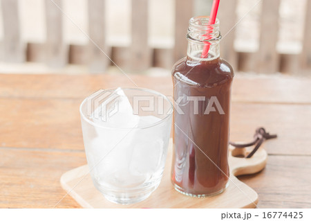 Bottle of black coffee with ice 16774425