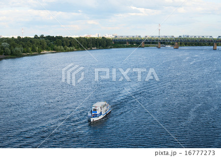 The boat floating in the blue Dnieper waters The boat floating in the blue Dnieper waters 16777273