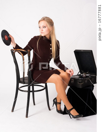 Pretty blonde woman with gramophone Pretty blonde woman with gramophone 16777881
