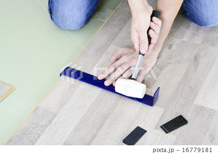 Man with Tools to Laying Laminate Man with Tools to Laying Laminate 16779181
