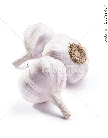 Three garlic heads isolated on white background Three garlic heads isolated on white background 16783427