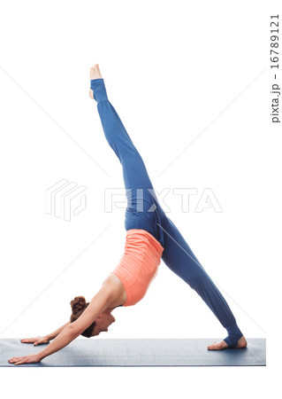Sporty fit yogini woman practices yoga asana eka pada adhomukha  16789121