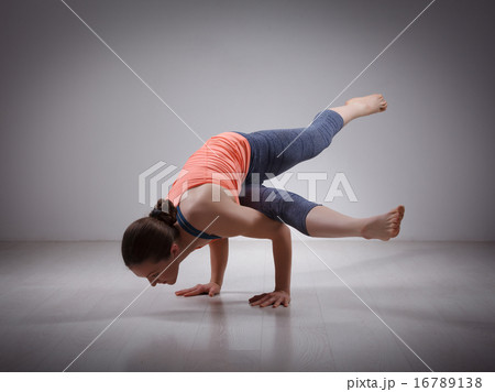 Beautiful sporty fit yogi girl practices yoga asana eka pada kou 16789138