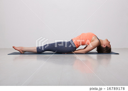 Beautiful sporty fit yogi girl practices yoga asana Matsyasana 16789178
