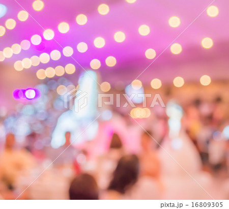 many people at a wedding ceremony in large hall. 16809305