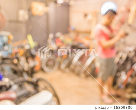 blurred image of lots of parked bikes. Useful as background 16809306