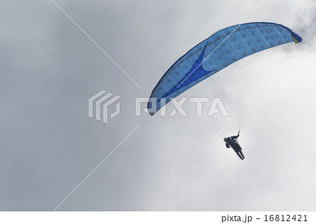 hang glider in the blue sky 16812421