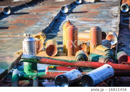 Used graffiti spray cans laying around 16815456