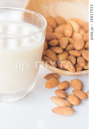 Almond milk and grain on white kitchen table 16817033