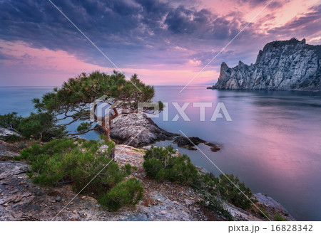 Beautiful summer sunset at the sea with mountains 16828342