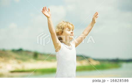 Happy child with raised arms Happy child with raised arms 16828586