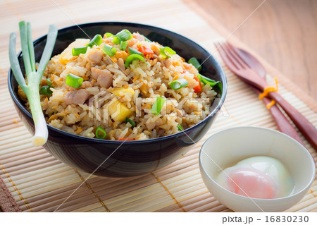 Fried Rice and soft-boiled egg on wooden table 16830230