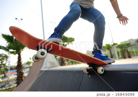 skateboarding at skatepark 16843099