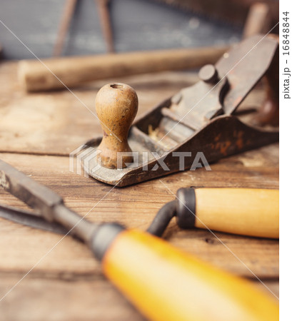 Od vintage hand tools on wooden background. 16848844