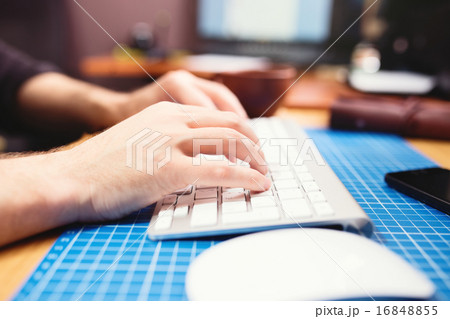 Close up of male hands typing. Selective focus 16848855